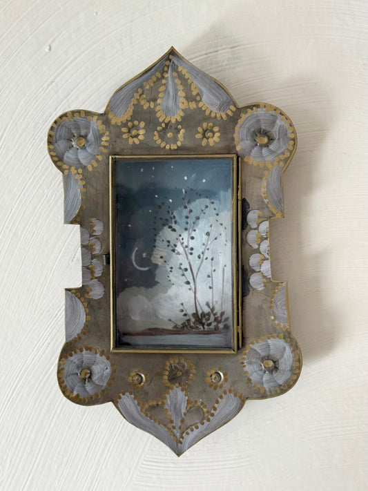"Anapamu" twilight sky with crescent moon and tree painted in a Mexican nicho tin