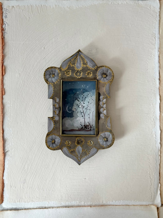 "Anapamu" twilight sky with crescent moon and tree painted in a Mexican nicho tin