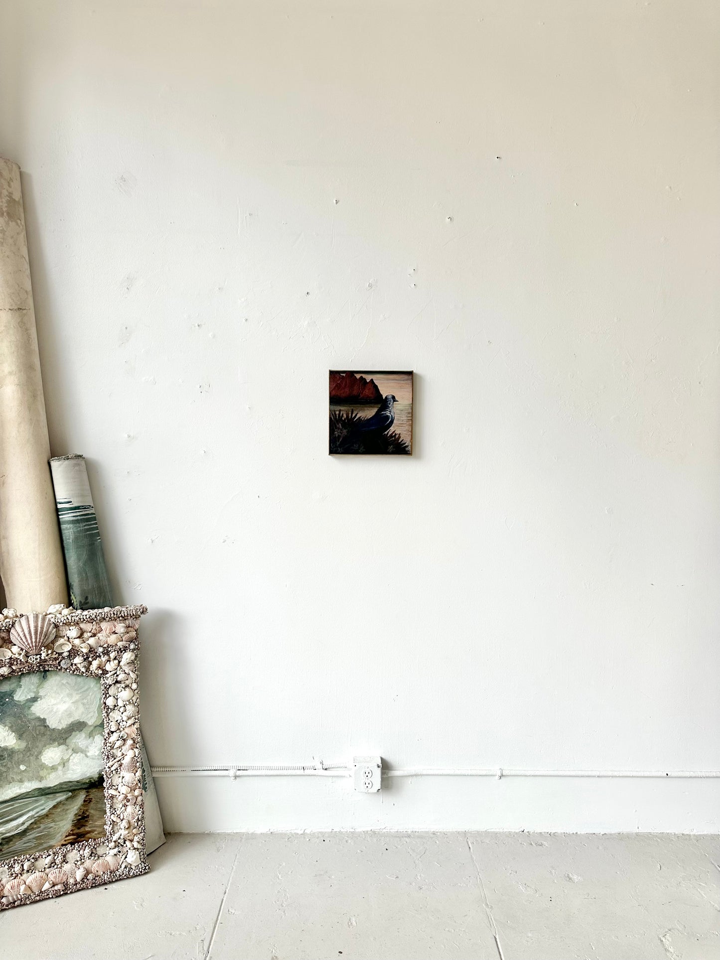 "Watchful" 12" x 12" fine art print on canvas depicting a blackbird looking out to sea