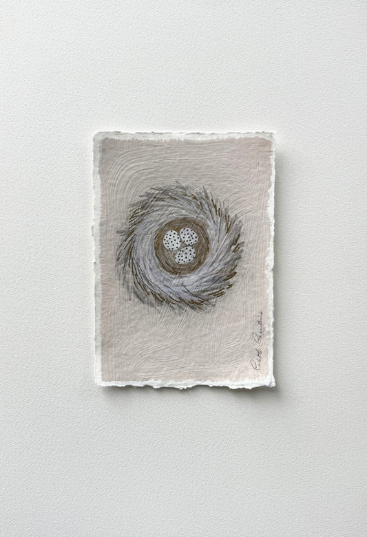Painting of eggs in a nest on handmade paper