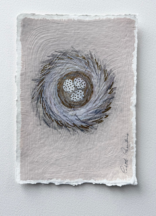 Painting of eggs in a nest on handmade paper