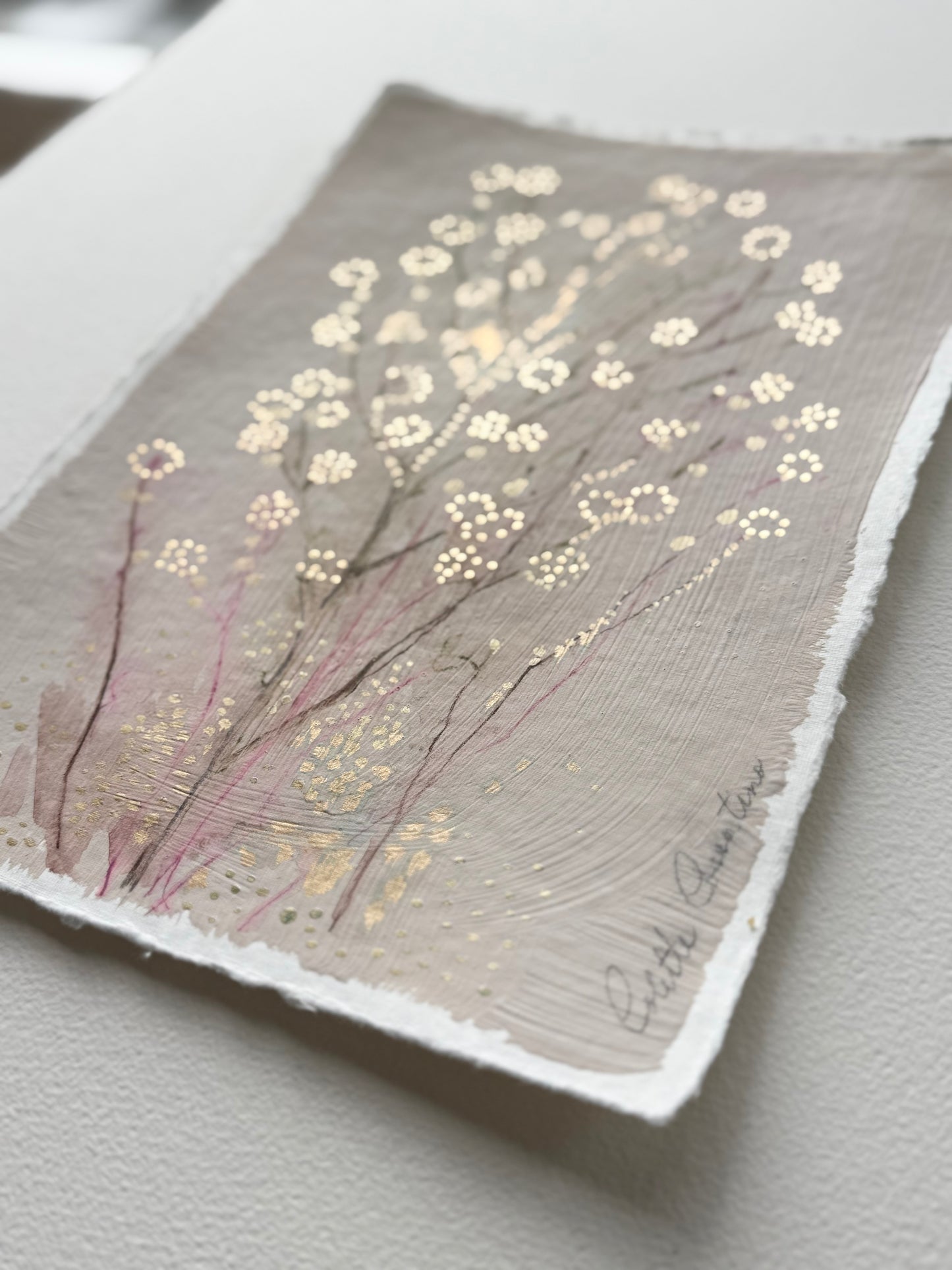 Painting of delicate flowers on handmade paper