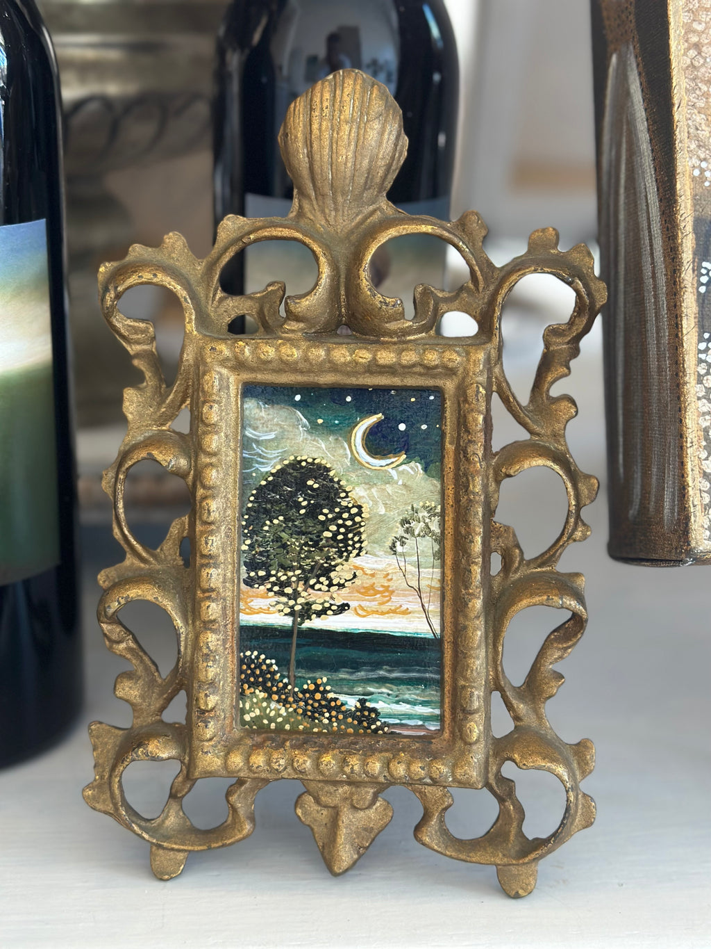 "Otherland's Crescent Moon" oil on paper, mounted in vintage Baroque metal frame